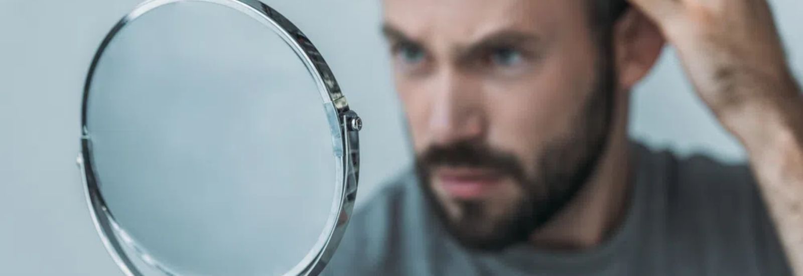 Man looking at mirror