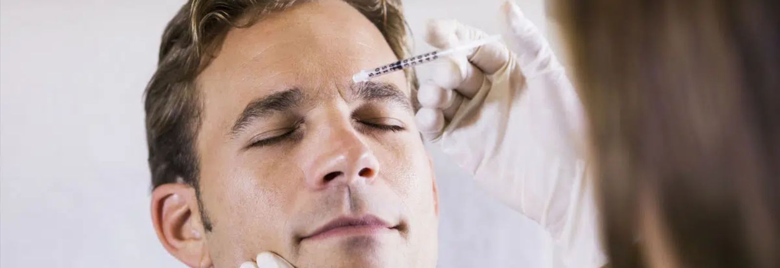Man undergoing botox treatment